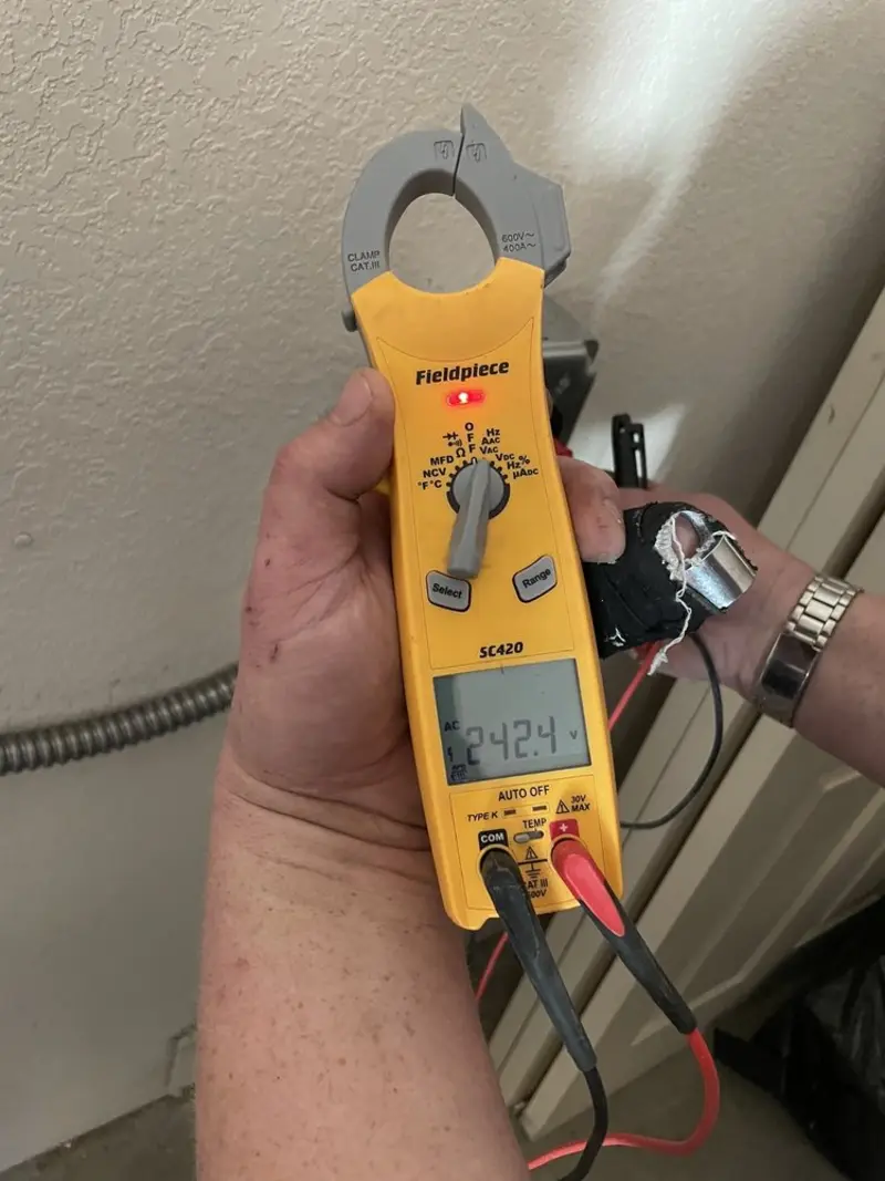 Voltage testing with clamp meter during Outlet Installation in Mount Pocono